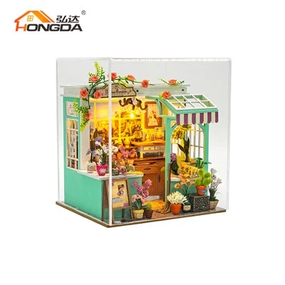 Maison de poupée bricolage sur le thème du jardin avec cache-poussière